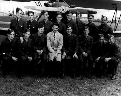 arms_air_training_prog_2 A group photograph is taken after each step of the training programme. Here, trainees at Manning Depot No 5 in Lachine, Quebec, with instructor V. Beauvilliers, 13th June, 1943.