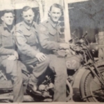 Harold Daley, Jim McLaughlin and unknown on motorbike in England