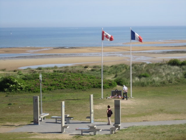 Juno Park ©CJB Colour photo. A view of Juno Park, the beach, and a small memorial